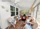 Cozy sunroom with lots of natural light from the windows and door to the backyard at 116 S Lanier Ave, Fort Meade, FL 33841