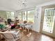 Cozy sunroom with lots of natural light from the windows and door to the backyard at 116 S Lanier Ave, Fort Meade, FL 33841