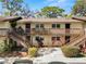 Charming two-story condominium building with inviting balconies and well-maintained landscaping at 141 Fernery Rd # C-6, Lakeland, FL 33809