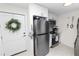 Well-lit kitchen featuring stainless steel appliances and white cabinets with a cozy breakfast nook at 141 Fernery Rd # C-6, Lakeland, FL 33809