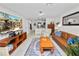 Inviting living room featuring a leather sofa, stylish rug, and a flatscreen TV for a cozy, modern feel at 141 Fernery Rd # C-6, Lakeland, FL 33809