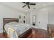 Comfortable bedroom with hardwood floors, ceiling fan, and neutral wall color at 1539 E Fern Rd, Lakeland, FL 33801