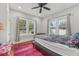 Cozy bedroom with natural light, curtains, hardwood floors and ceiling fan at 1539 E Fern Rd, Lakeland, FL 33801