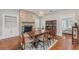 Cozy dining room with hardwood floors, fireplace, and a traditional china cabinet at 1539 E Fern Rd, Lakeland, FL 33801