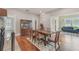 Inviting dining room featuring hardwood floors, a wooden table, and a classic china cabinet at 1539 E Fern Rd, Lakeland, FL 33801