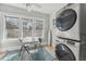 Well-lit laundry room features modern washer and dryer, a table with chairs and plenty of natural light at 1539 E Fern Rd, Lakeland, FL 33801