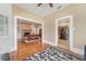 Open-concept living room showcasing hardwood floors, neutral walls, and seamless transition to dining and kitchen areas at 1539 E Fern Rd, Lakeland, FL 33801