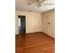 Open concept living room featuring wood-look floors, neutral walls, and a ceiling fan at 1560 Imperial Ave, Bartow, FL 33830