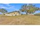 Spacious backyard with mature trees and new fence at 1702 Valencia Blvd, Bartow, FL 33830