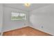 Well-lit bedroom with wood floors and a large window at 1702 Valencia Blvd, Bartow, FL 33830