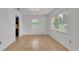 Dining room featuring tile floors and natural light from a large window at 1702 Valencia Blvd, Bartow, FL 33830