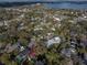 Aerial view of home in a mature neighborhood near a large lake at 1819 Pawnee Trl, Lakeland, FL 33803