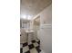 Classic bathroom featuring a pedestal sink and black and white tile floor at 1819 Pawnee Trl, Lakeland, FL 33803