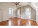 Sunlit bedroom with hardwood floors, closet and natural light from windows at 1819 Pawnee Trl, Lakeland, FL 33803