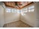 Inviting bedroom featuring wood ceilings, a fan, and an abundance of natural light at 1819 Pawnee Trl, Lakeland, FL 33803