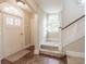 Light-filled entryway features a traditional door, parquet floors, and staircase at 1819 Pawnee Trl, Lakeland, FL 33803