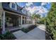 Sun-drenched front porch with large windows, offering ample natural light and a glimpse of the surrounding landscape at 1819 Pawnee Trl, Lakeland, FL 33803