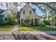 Charming home featuring a well-manicured lawn, lush landscaping, and a stone walkway leading to the entrance at 1819 Pawnee Trl, Lakeland, FL 33803