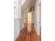 Long hallway features hardwood floors and white trim at 1819 Pawnee Trl, Lakeland, FL 33803