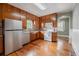 Functional kitchen features warm wood cabinets, a window above the sink, and plenty of countertop space at 1819 Pawnee Trl, Lakeland, FL 33803