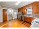 Kitchen featuring stainless steel appliances, ample wood cabinets, and wood floors at 1819 Pawnee Trl, Lakeland, FL 33803