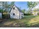 Backyard shed featuring a simple design and grassy surroundings at 1819 Pawnee Trl, Lakeland, FL 33803