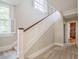 Bright staircase featuring a window and wood trim at 1819 Pawnee Trl, Lakeland, FL 33803