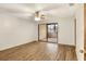 Bedroom featuring a ceiling fan and sliding glass doors to a deck at 1880 N Crystal Lake Dr # 4, Lakeland, FL 33801