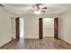 Bedroom with ceiling fan, vinyl flooring and closet doors at 1880 N Crystal Lake Dr # 4, Lakeland, FL 33801