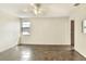 Bedroom with neutral walls, ceiling fan, and a window allowing natural light at 1880 N Crystal Lake Dr # 4, Lakeland, FL 33801