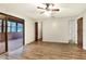 Bright bedroom with sliding glass doors and wood-look floors at 1880 N Crystal Lake Dr # 4, Lakeland, FL 33801