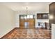 Dining area with tile flooring and an adjacent kitchen at 1880 N Crystal Lake Dr # 4, Lakeland, FL 33801