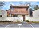 This two-story townhome features a private front patio with mature landscaping, offering a cozy outdoor space at 1880 N Crystal Lake Dr # 4, Lakeland, FL 33801