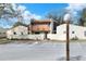 Inviting exterior view of condo featuring two-story design, stucco walls, and convenient parking at 1880 N Crystal Lake Dr # 4, Lakeland, FL 33801