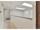 Hallway featuring tile flooring, two skylights, and access to other rooms at 1880 N Crystal Lake Dr # 4, Lakeland, FL 33801