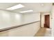 Well-lit hallway with skylights and a partial wall partition at 1880 N Crystal Lake Dr # 4, Lakeland, FL 33801