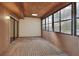 Enclosed porch featuring wood ceiling, wood floor, sliding glass door, and windows at 1880 N Crystal Lake Dr # 4, Lakeland, FL 33801