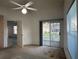 Bedroom with large windows and a view of the screened-in patio at 2021 Windward Pass, Lakeland, FL 33813