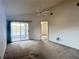 Bedroom featuring a ceiling fan, sliding glass doors, and lake view at 2021 Windward Pass, Lakeland, FL 33813