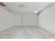 Unfinished basement with tile floors, neutral walls, and ample space for future customization at 211 Emanuelle Dr, Winter Haven, FL 33884