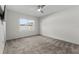 Bedroom featuring a ceiling fan, carpet flooring, a window, and natural light at 211 Emanuelle Dr, Winter Haven, FL 33884