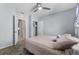 Bedroom featuring light blue walls, carpet flooring, and ensuite bathroom access at 211 Emanuelle Dr, Winter Haven, FL 33884