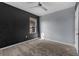 Bedroom featuring gray walls, a dark accent wall, and plush carpet flooring at 211 Emanuelle Dr, Winter Haven, FL 33884