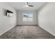 Bedroom featuring carpet flooring, a ceiling fan, natural light, and neutral-colored walls at 211 Emanuelle Dr, Winter Haven, FL 33884