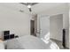 Bright bedroom featuring a ceiling fan, white walls, and plush carpet flooring at 211 Emanuelle Dr, Winter Haven, FL 33884