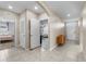 Inviting hallway with tiled floors, multiple accessways, and abundant natural light, creating an open and airy atmosphere at 211 Emanuelle Dr, Winter Haven, FL 33884