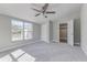 Inviting bedroom with carpet, a ceiling fan, and a closet, offering ample storage at 22 S Cherokee Ave, Fort Meade, FL 33841