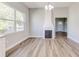 Dining room featuring hardwood floors and a white-painted fireplace at 22 S Cherokee Ave, Fort Meade, FL 33841