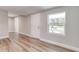 Bright entryway features wood-look floors, a white door, and a large window for natural light at 22 S Cherokee Ave, Fort Meade, FL 33841