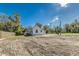 White home with a new roof and partially cleared yard at 22 S Cherokee Ave, Fort Meade, FL 33841